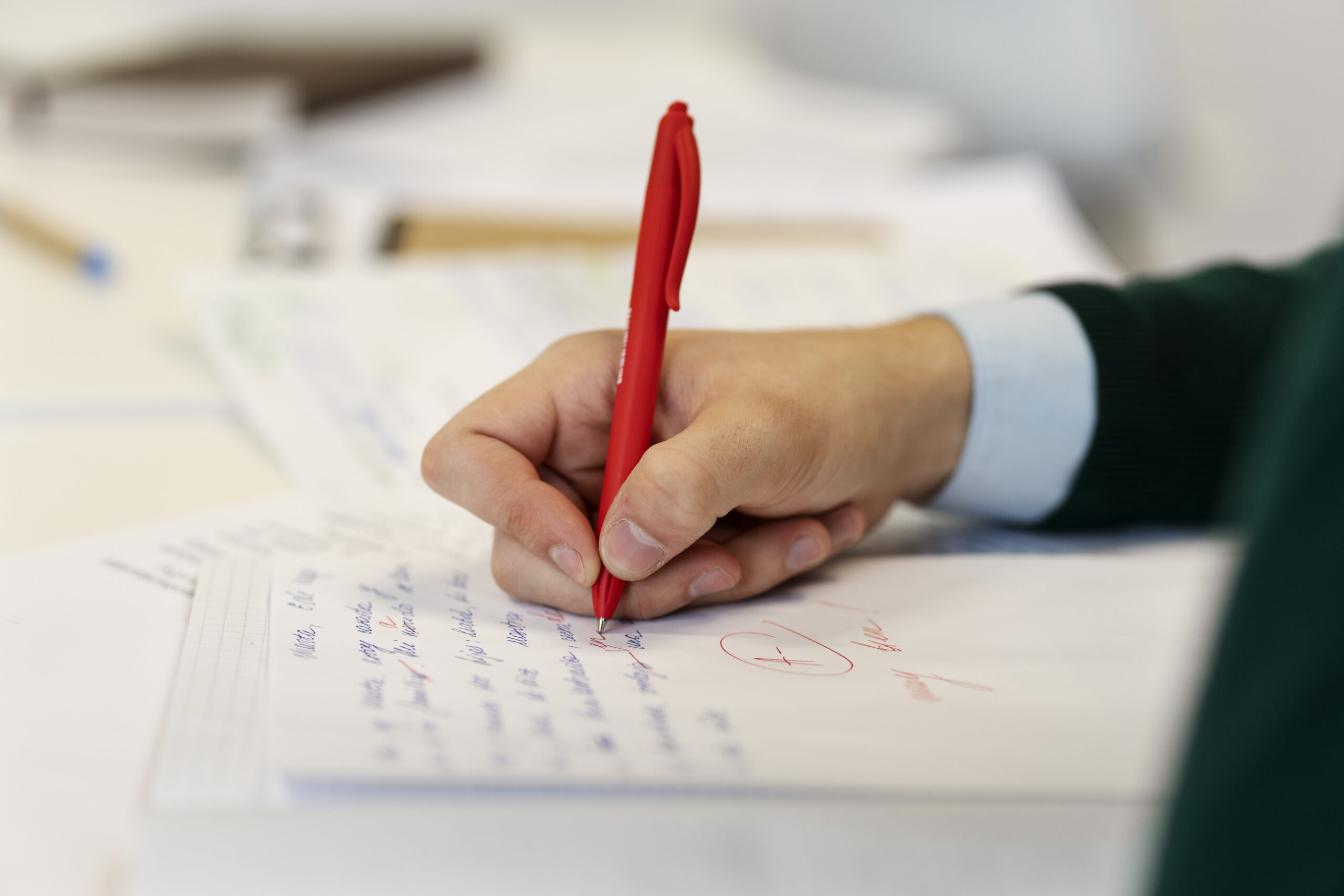 side-view-hand-correcting-grammar-mistakes